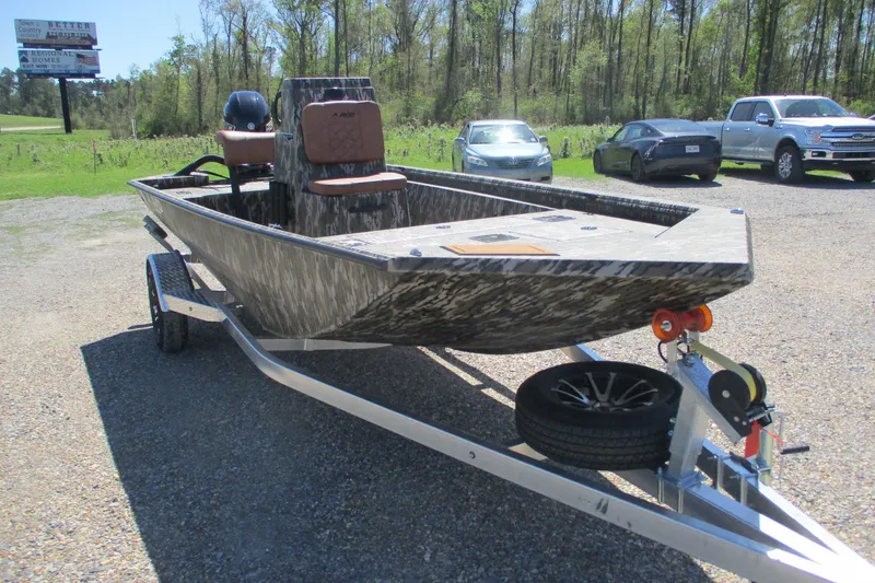 Slide: The Image of 2026 Avid 18 Rogue CC boat on trailer in outdoor setting. - 2