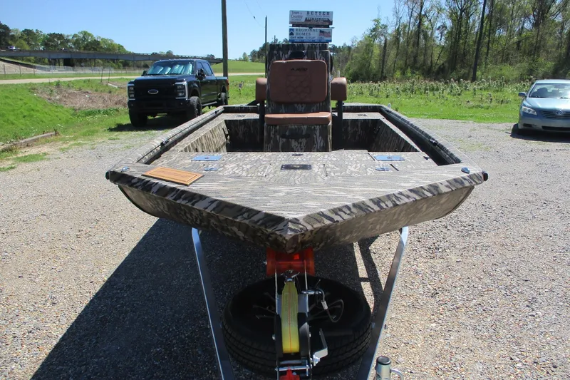 Slide: The Image of 2026 Avid 18 Rogue CC boat on trailer, parked outdoors on gravel. - 3
