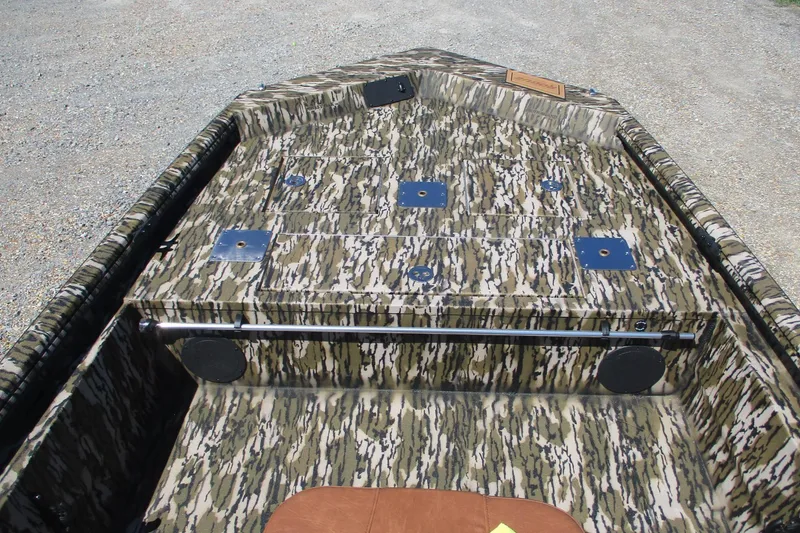 Slide: The Image of Camouflage interior of 2026 Avid 18 Rogue CC boat, featuring storage compartments. - 8