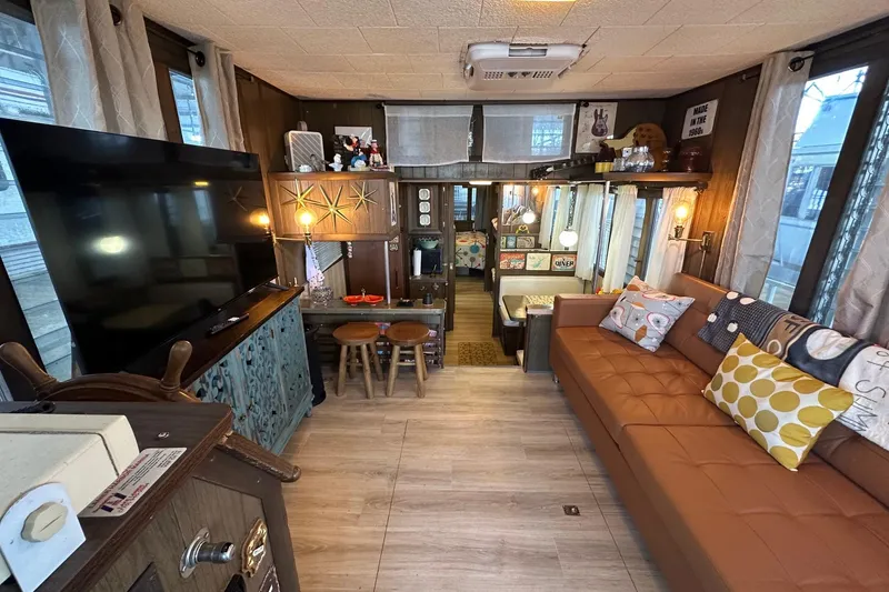 Slide: The Image of Vintage 1966 Lazy Days RV interior with retro decor and cozy seating area. - 2