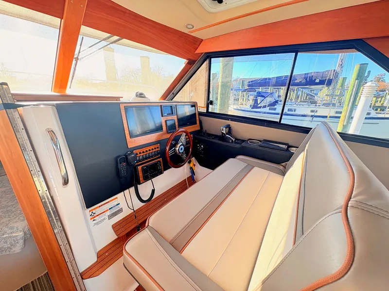 Slide: The Image of Interior of 2023 Cutwater 32 Coupe with modern helm console. - 18