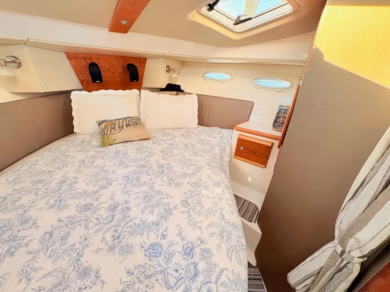 Slide: The Image of Interior of 2023 Cutwater 32 Coupe with cozy bed. - 21