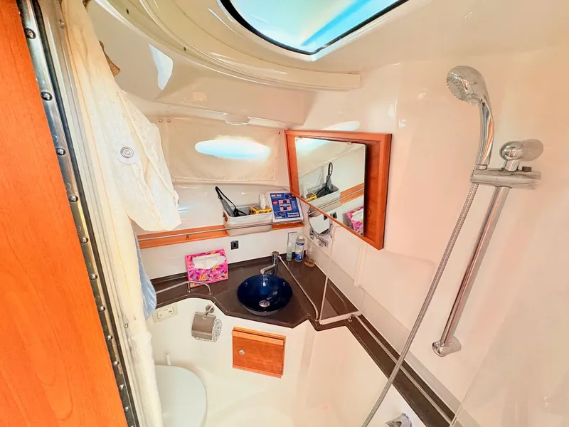 Slide: The Image of Interior view of the bathroom on the 2023 Cutwater 32 Coupe. - 22
