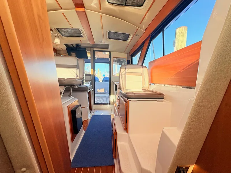 Slide: The Image of Interior of 2023 Cutwater 32 Coupe with modern amenities. - 27