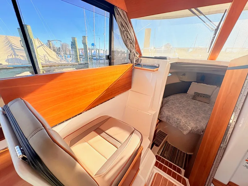 Slide: The Image of Interior of 2023 Cutwater 32 Coupe featuring cozy cabin. - 28