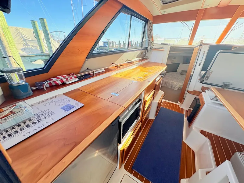 Slide: The Image of Interior of 2023 Cutwater 32 Coupe with wooden finish. - 31