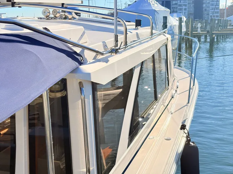 Slide: The Image of 2023 Cutwater 32 Coupe docked with blue cover. - 39