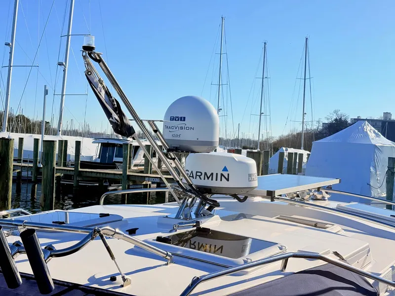 Slide: The Image of 2023 Cutwater 32 Coupe with Garmin equipment at the marina. - 40