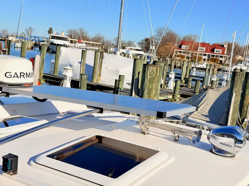 Slide: The Image of 2023 Cutwater 32 Coupe with solar panel and Garmin equipment at the marina. - 41