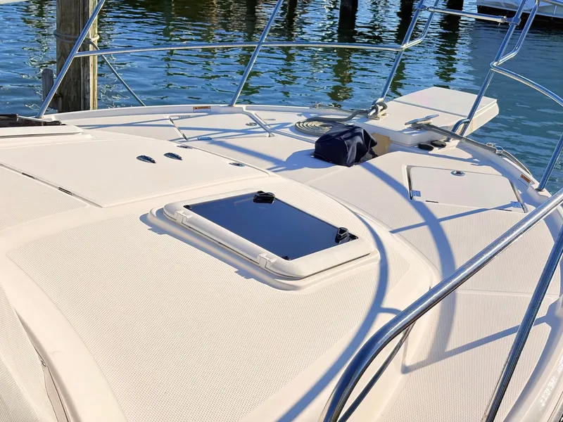 Slide: The Image of Deck of 2023 Cutwater 32 Coupe with water in the background. - 42