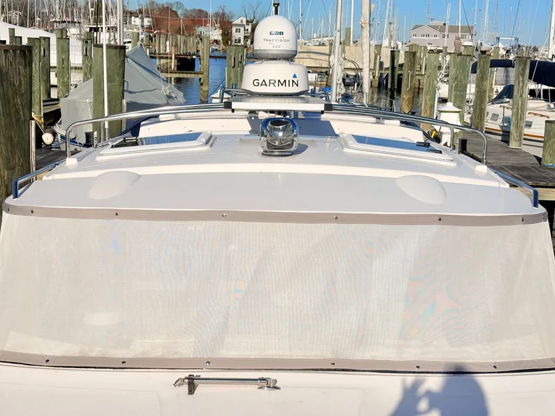 Slide: The Image of 2023 Cutwater 32 Coupe boat docked with Garmin equipment. - 43