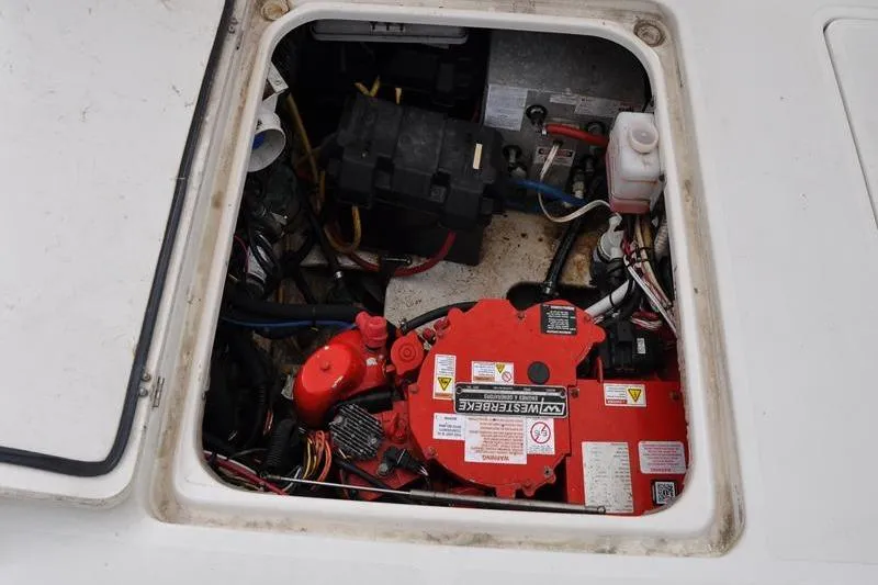 Slide: The Image of Engine compartment of a 2006 Pursuit 345 Drummond Sportfish boat, showing wiring and components. - 5