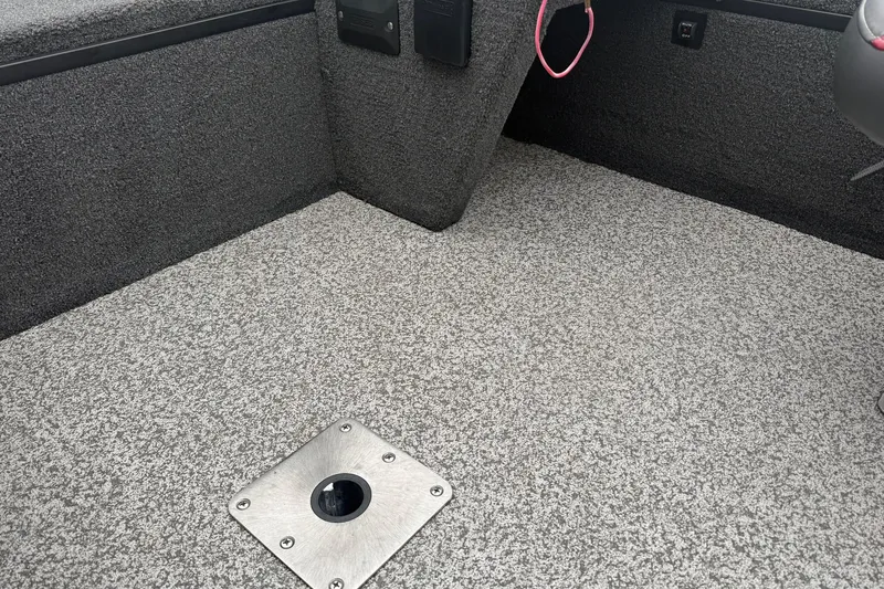Slide: The Image of 2019 Ranger VS1660 boat interior with textured flooring and metal fixture. - 10