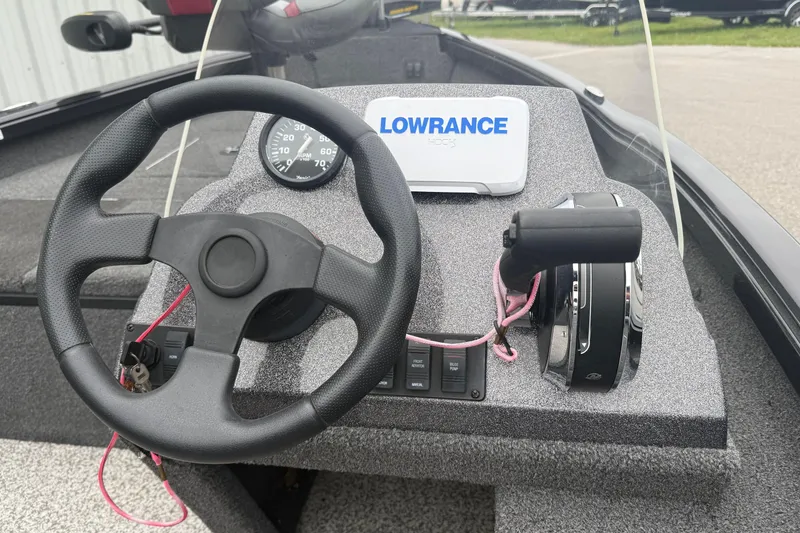 Slide: The Image of 2019 Ranger VS1660 boat dashboard with steering wheel, throttle, and Lowrance GPS. - 11