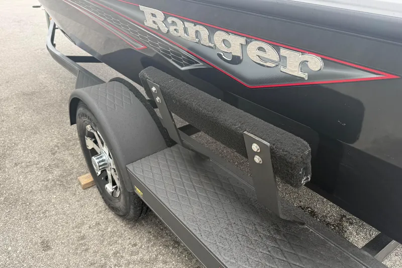 Slide: The Image of 2019 Ranger VS1660 boat trailer with black fender and logo detail. - 4