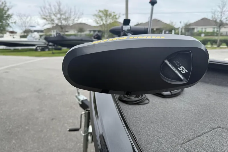 Slide: The Image of 2019 Ranger VS1660 boat with Minn Kota PowerDrive motor in a parking area. - 6