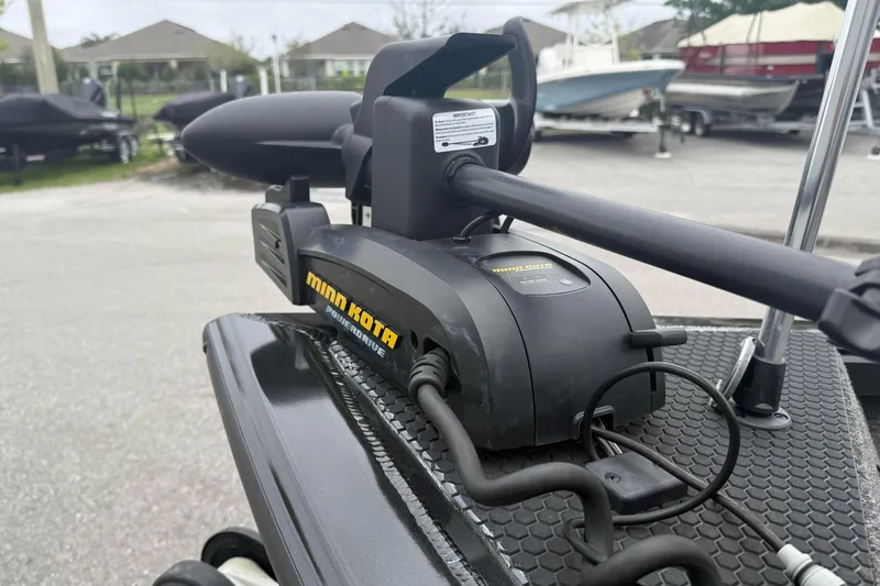 Slide: The Image of Minn Kota PowerDrive motor on 2019 Ranger VS1660 boat, parked with other boats. - 7