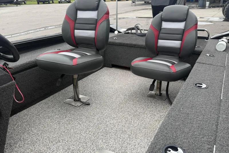 Slide: The Image of 2019 Ranger VS1660 boat interior with two cushioned seats and gray carpet flooring. - 8