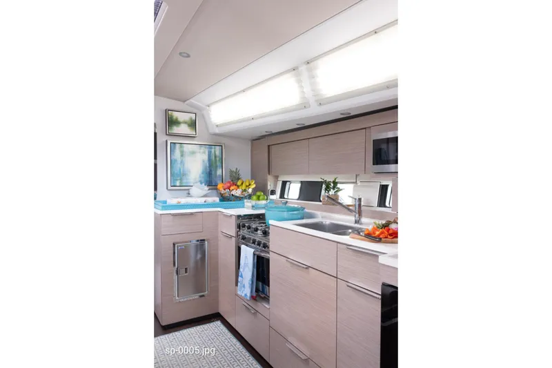 Slide: The Image of Modern kitchen interior of 2023 Hanse 460 yacht with sleek cabinetry and appliances. - 10