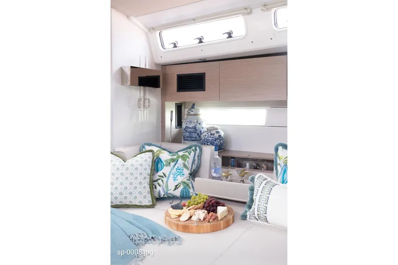 Slide: The Image of Luxurious interior of 2023 Hanse 460 yacht with elegant decor and gourmet platter. - 12
