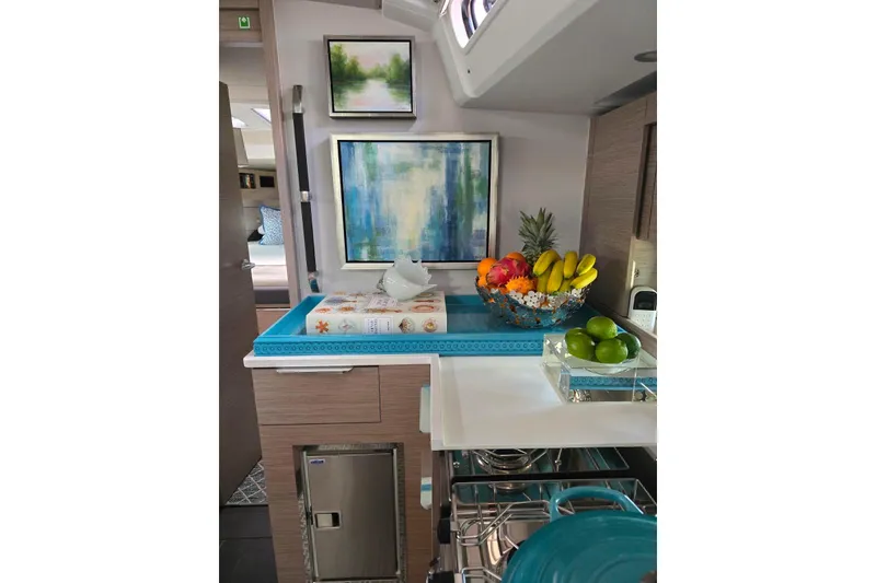 Slide: The Image of Modern kitchen interior of 2023 Hanse 460 yacht with vibrant fruit display and artwork. - 5