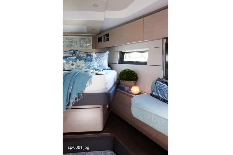 Slide: The Image of Luxurious interior of 2023 Hanse 460 yacht with cozy bedding and elegant decor. - 7