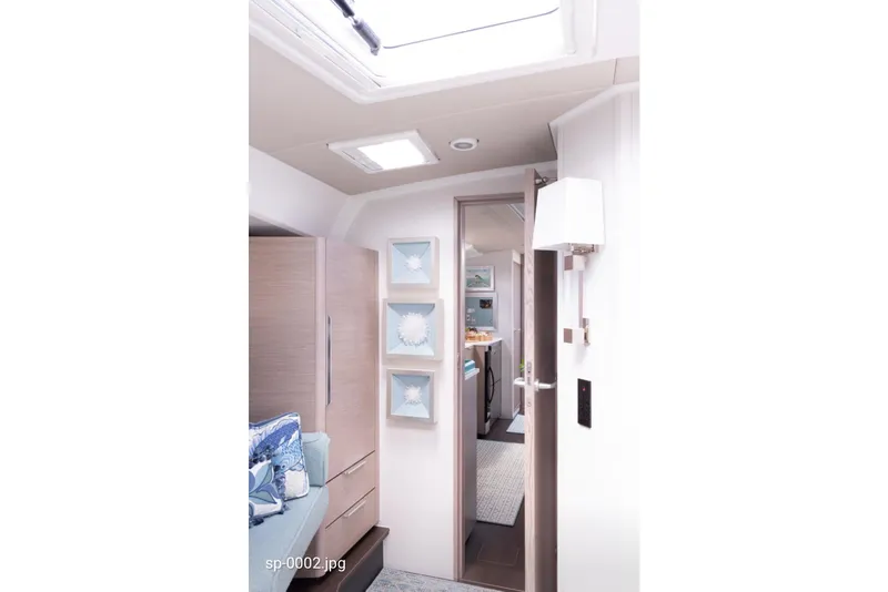 Slide: The Image of Interior of 2023 Hanse 460 yacht, featuring modern decor and elegant lighting. - 8