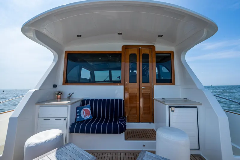 Slide: The Image of 2017 Grand Banks 44 Eastbay SX yacht with elegant seating and ocean view. - 14