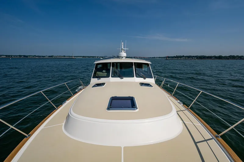 Slide: The Image of 2017 Grand Banks 44 Eastbay SX yacht cruising on open water. - 20