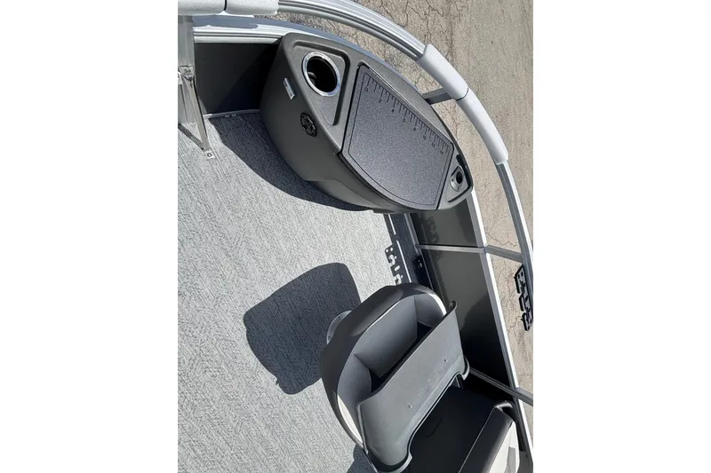 Slide: The Image of 2026 Sun Tracker Party Barge 20 DLX interior with seating and cup holder. - 16