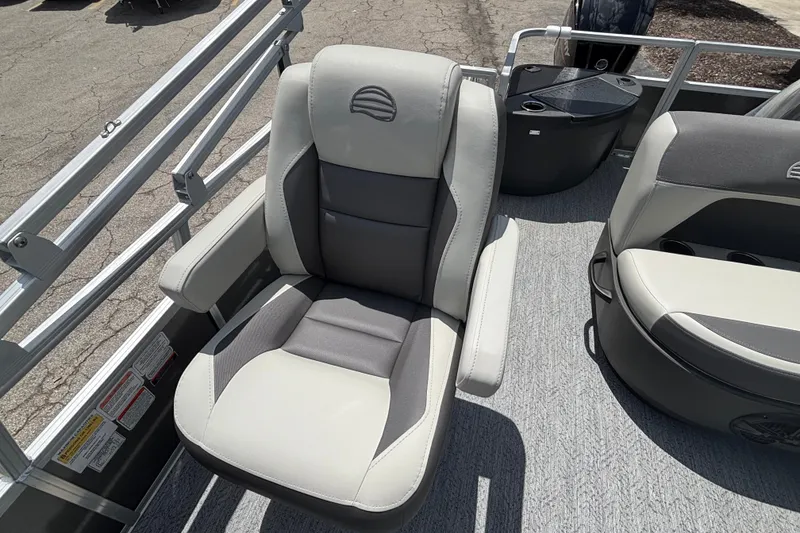 Slide: The Image of 2026 Sun Tracker Party Barge 20 DLX boat seat, featuring gray and white upholstery. - 12