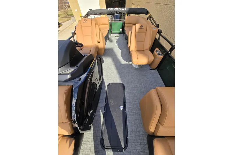 Slide: The Image of 2026 Regency 230 DL boat with sleek green exterior and reflective finish. - 3