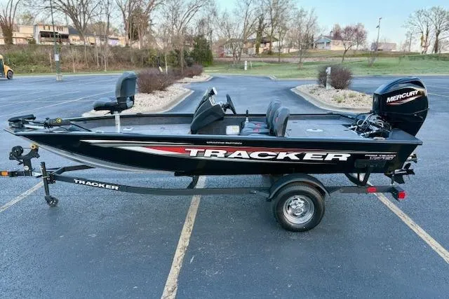 Slide: The Image of 2026 Tracker Pro Team 175 Crappie Edition boat with Mercury engine in parking lot. - 80