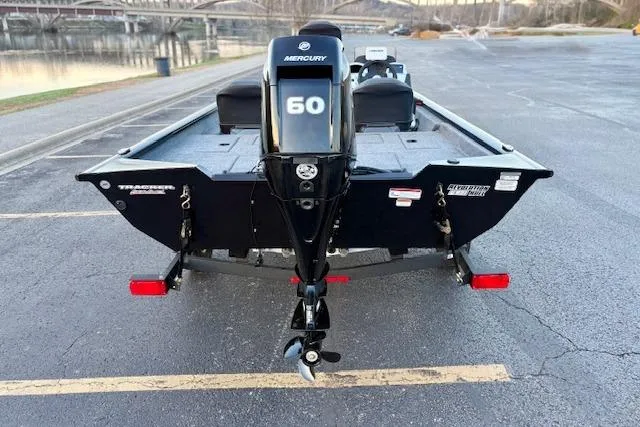 Slide: The Image of 2026 Tracker Pro Team 175 Crappie Edition boat with Mercury 60 engine, parked by a river. - 81