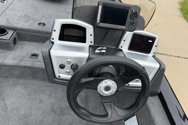Slide: The Image of Steering console of 2026 Tracker Pro Team 175 boat with navigation equipment. - 14