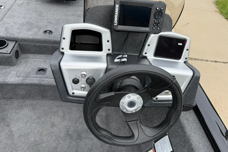 Slide: The Image of Steering console of 2026 Tracker Pro Team 175 boat with navigation equipment. - 13