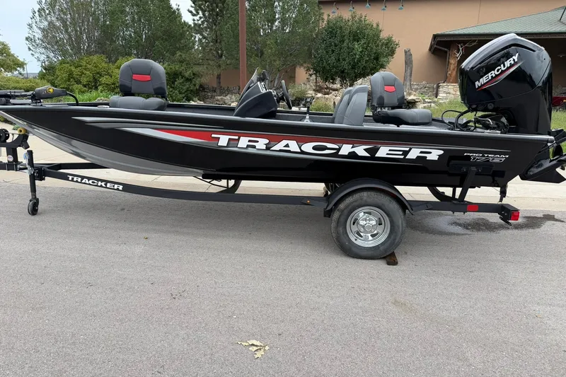 The Image of 2026 Tracker Pro Team 175 boat on trailer, featuring Mercury engine. - 0