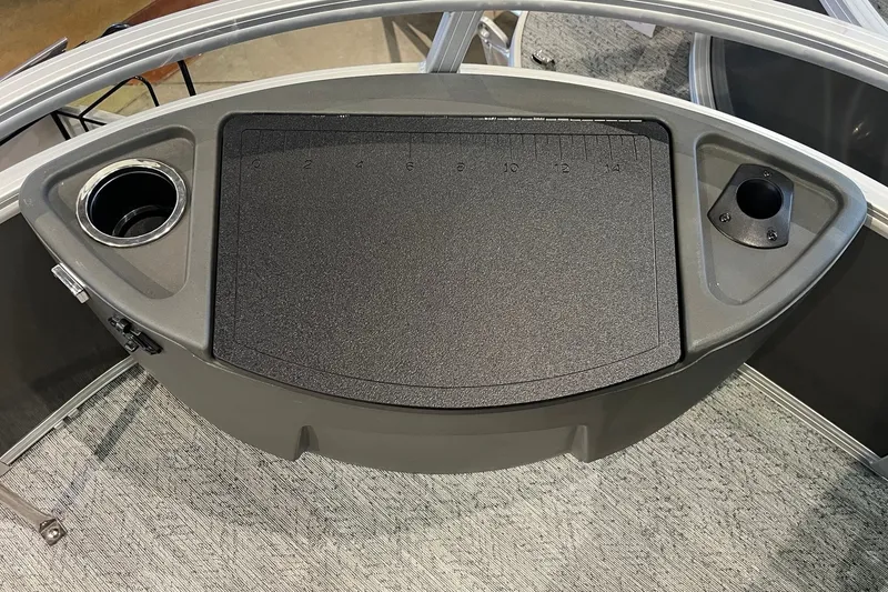 Slide: The Image of 2026 Sun Tracker Bass Buggy 18 DLX console with cup holder and measurement panel. - 27