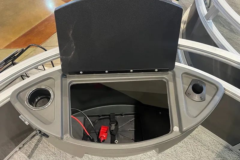 Slide: The Image of 2026 Sun Tracker Bass Buggy 18 DLX storage compartment with cup holder and wiring. - 28