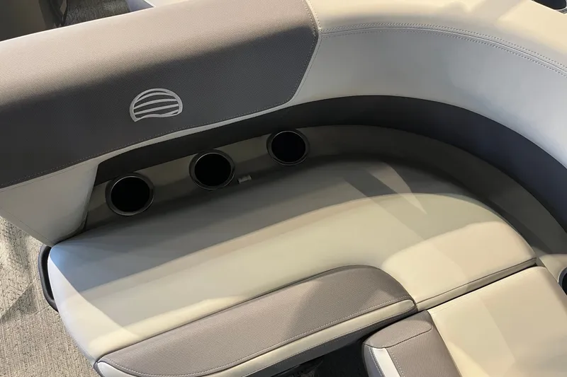Slide: The Image of 2026 Sun Tracker Bass Buggy 18 DLX boat seating with cup holders, featuring modern design. - 16