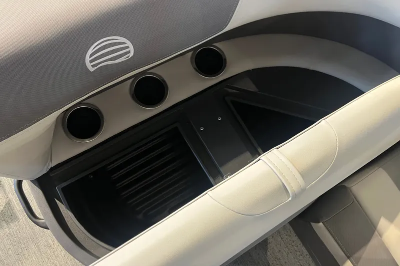 Slide: The Image of Interior view of 2026 Sun Tracker Bass Buggy 18 DLX boat seating and storage compartment. - 17