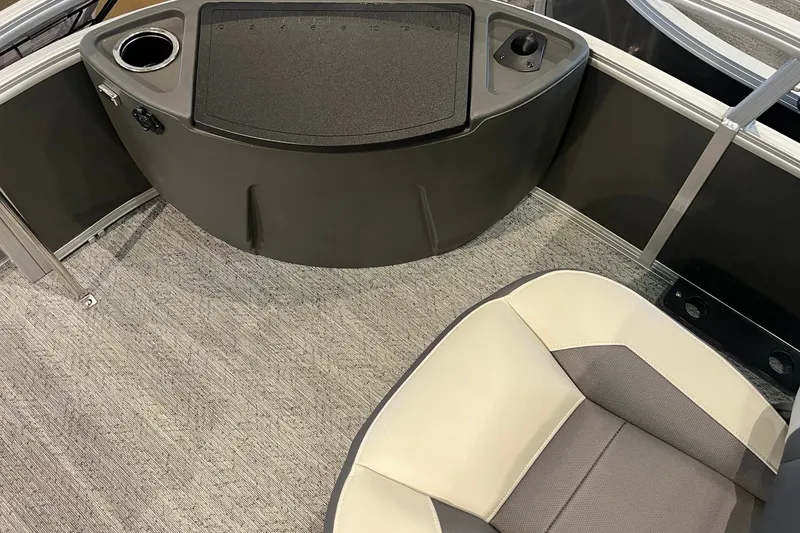 Slide: The Image of Interior of 2026 Sun Tracker Bass Buggy 18 DLX with seating and console details. - 26