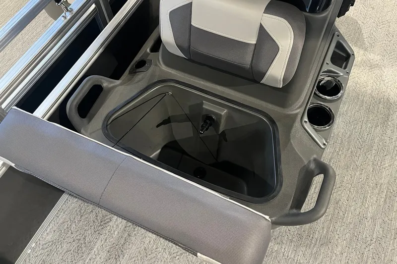 Slide: The Image of 2026 Sun Tracker Bass Buggy 18 DLX interior with seating and storage compartment. - 13