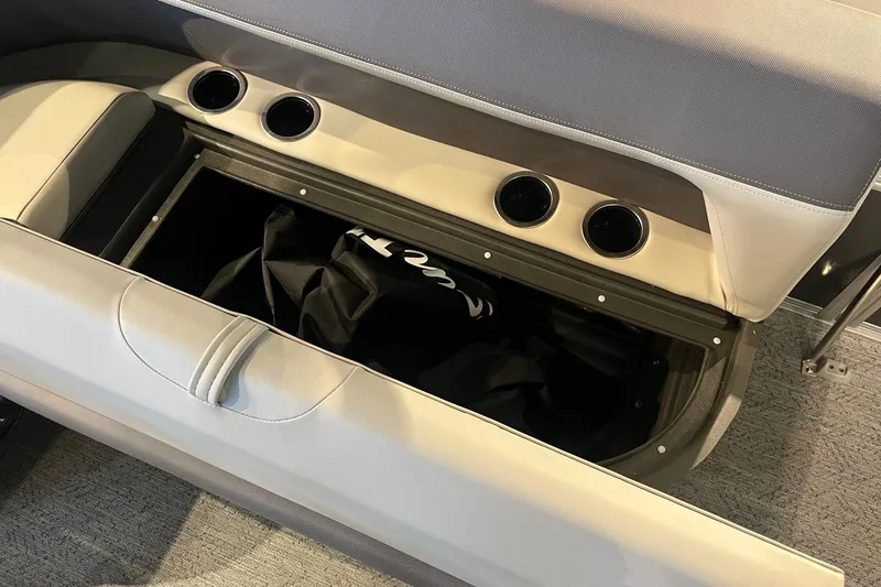 Slide: The Image of Open storage compartment in 2026 Sun Tracker Bass Buggy 18 DLX boat interior. - 15