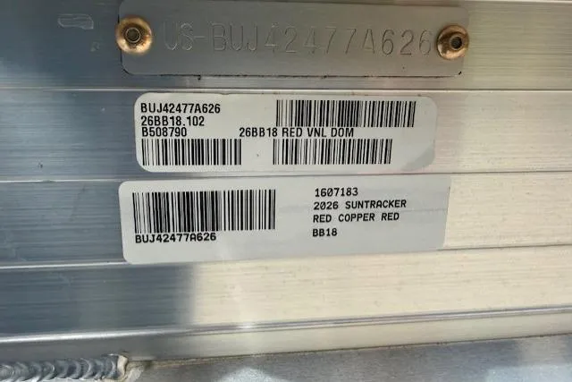 Slide: The Image of 2026 Sun Tracker Bass Buggy 18 DLX identification labels with barcodes and serial numbers. - 12