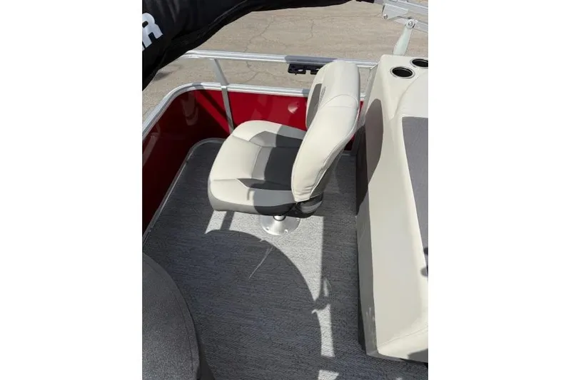 Slide: The Image of 2026 Sun Tracker Bass Buggy 18 DLX boat seat, featuring beige upholstery and red paneling. - 7