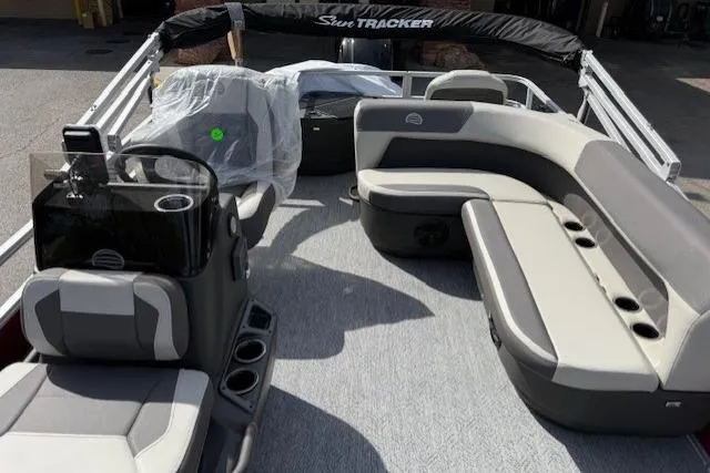 Slide: The Image of 2026 Sun Tracker Bass Buggy 18 DLX pontoon boat with spacious seating and modern design. - 8