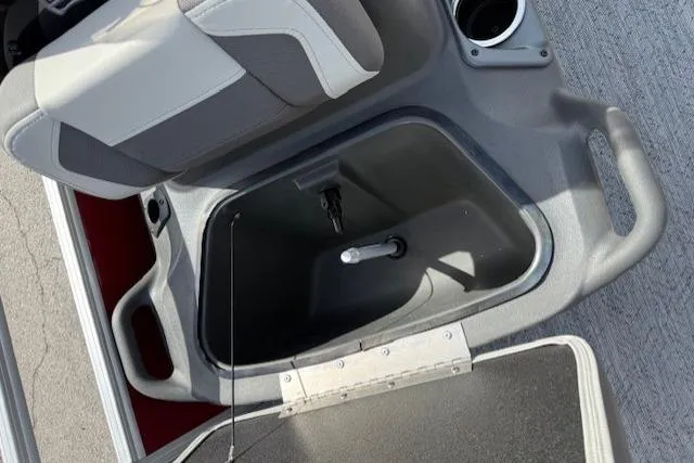 Slide: The Image of 2026 Sun Tracker Bass Buggy 18 DLX boat seat with storage compartment open. - 9