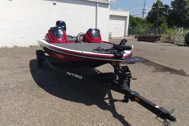 Slide: The Image of Red 2026 Nitro Z17 boat on trailer in outdoor setting. - 3