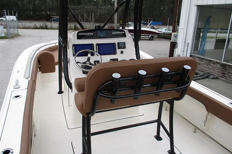 Slide: The Image of 2025 Pioneer 222 Islander boat interior with modern dashboard and seating. - 11